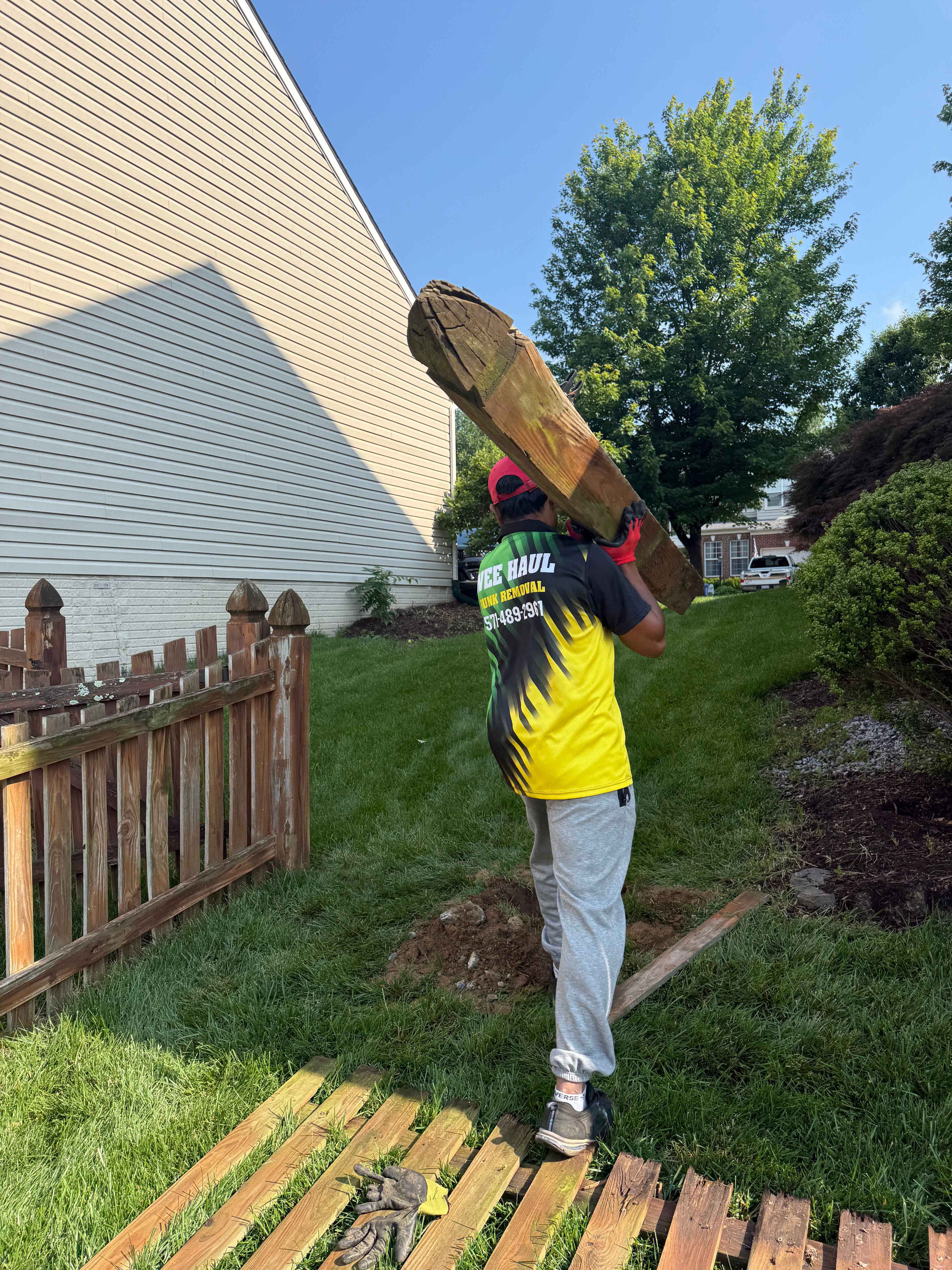 Fence removal logs and debris professionally cleared